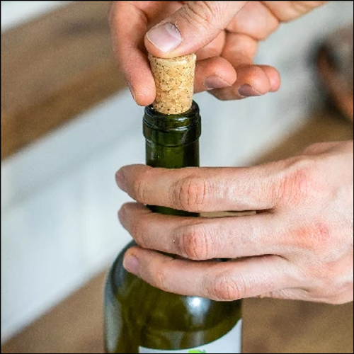 Wine bottle being opened (image source: https://nicolasperruche.com/Tapered-Cork-Stoppers-Wooden-Cork-Plugs-Natural-Wine-Bottle-1070206/)<br><audio controls src='/audio/Cork sound 1.m4a'></audio>
