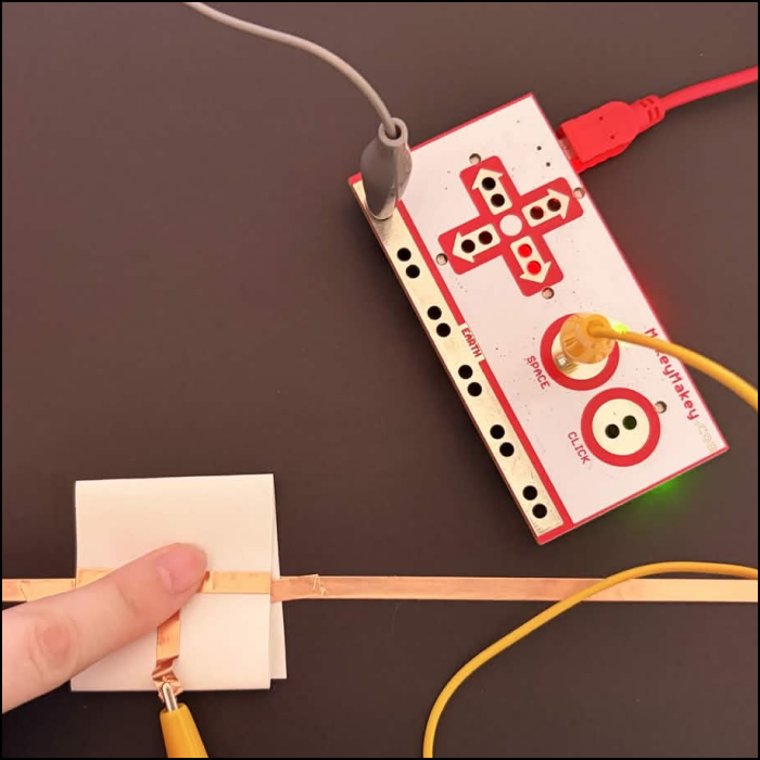And pressing the switch down and the light shows that it is working. This system would be used as a controller for my little pixel characters movements.